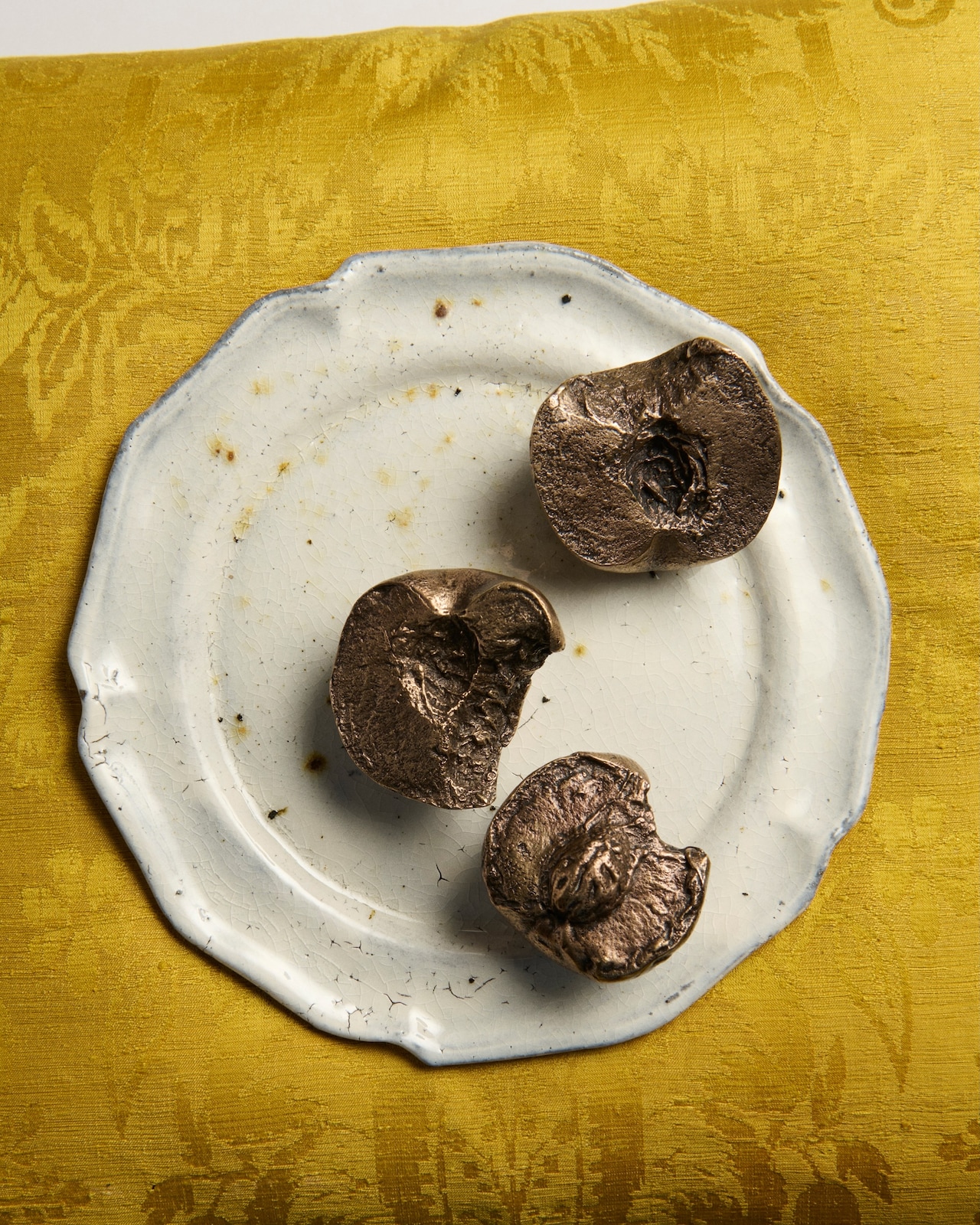 JW Anderson Luca Guadagnino peach paperweights