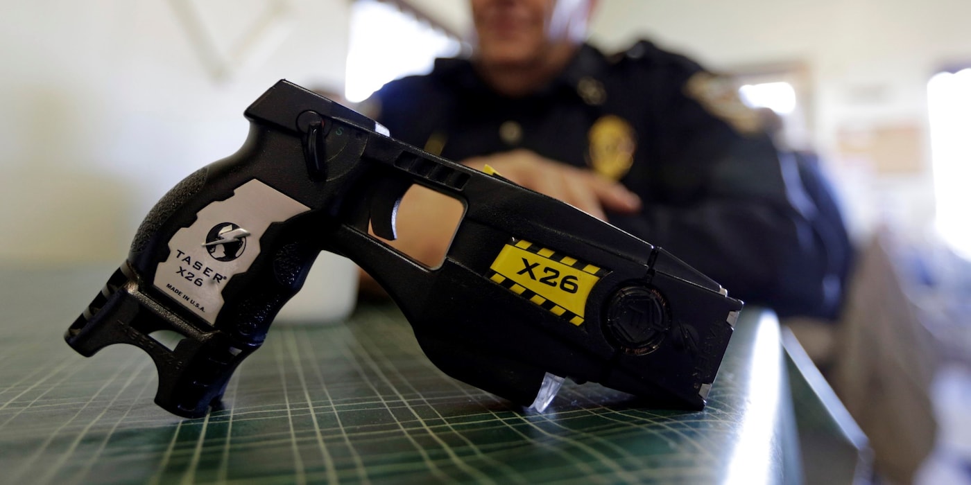 A policeman with a taser