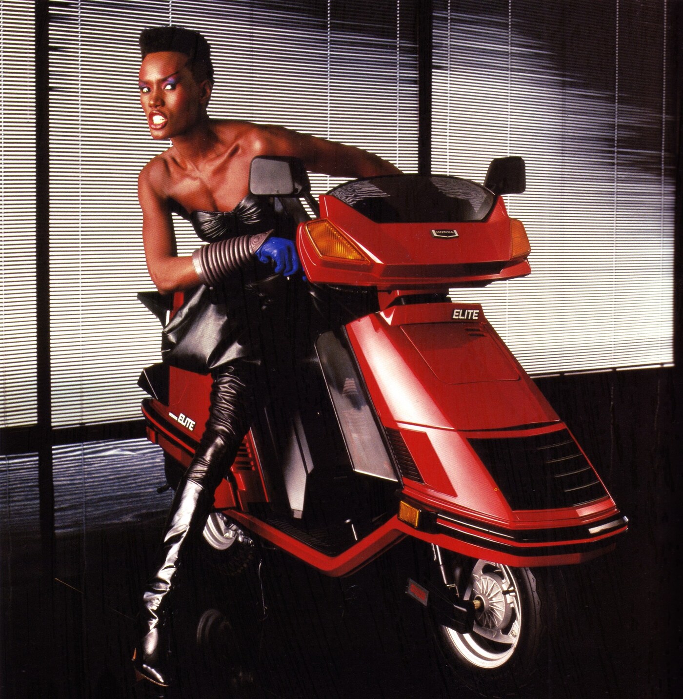 grace jones on a honda scooter
