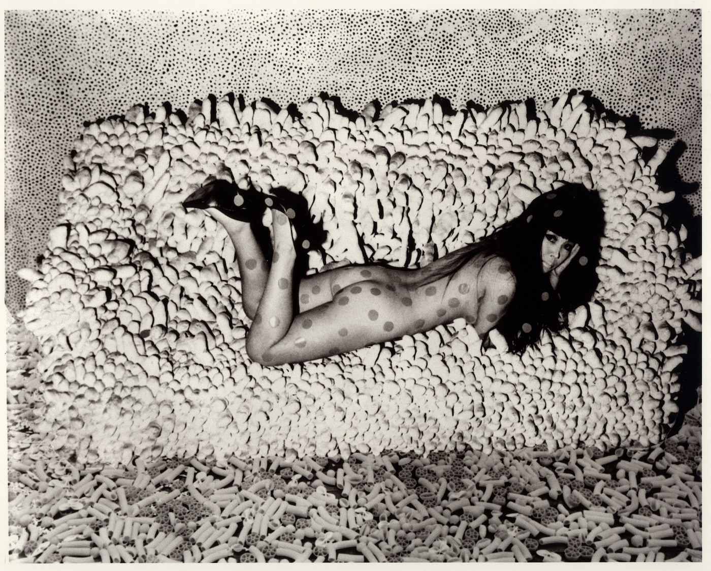 Kusama reclining on Accomulation
