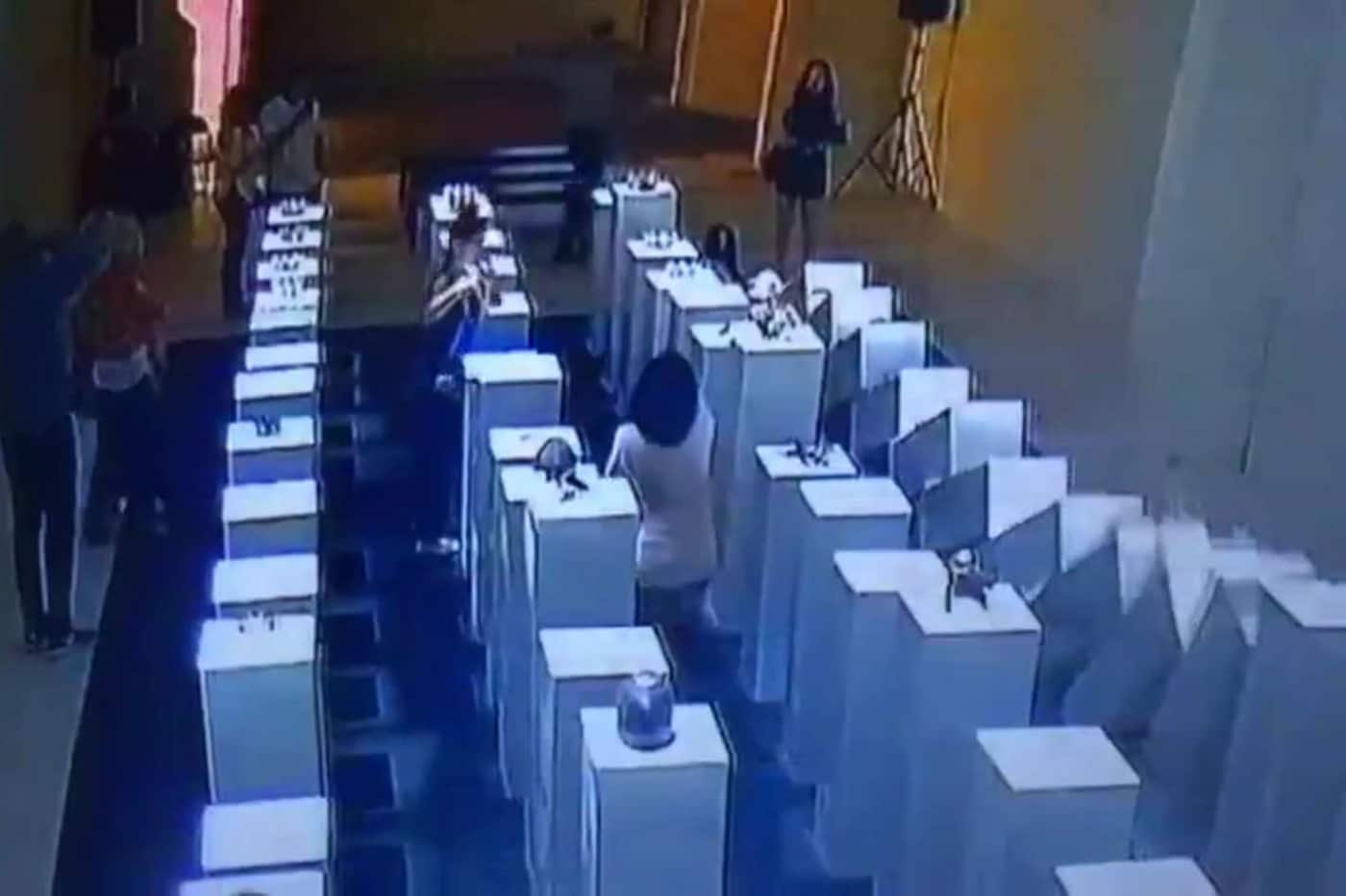 Woman destroys art taking selfie