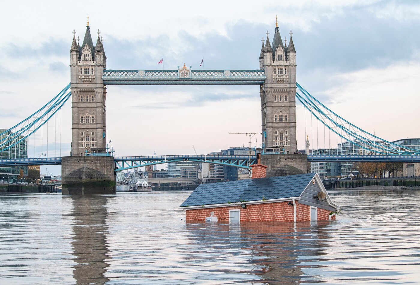 Extinction Rebellion sails sinking house down river Thames