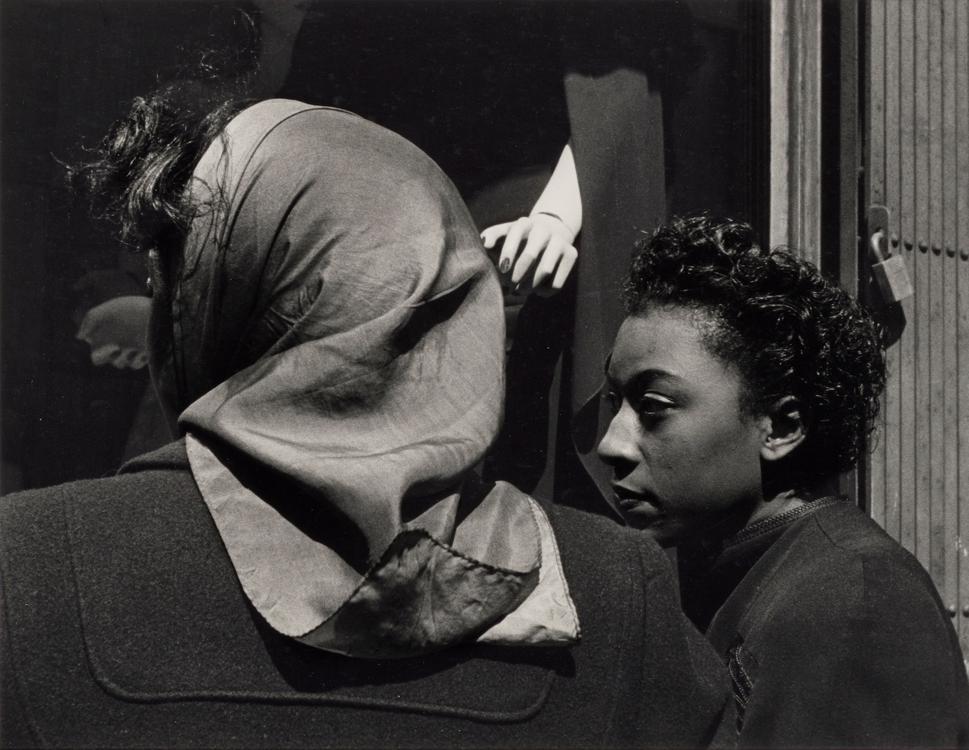Roy DeCarava, “Two women, mannequin’s hand” (1952)