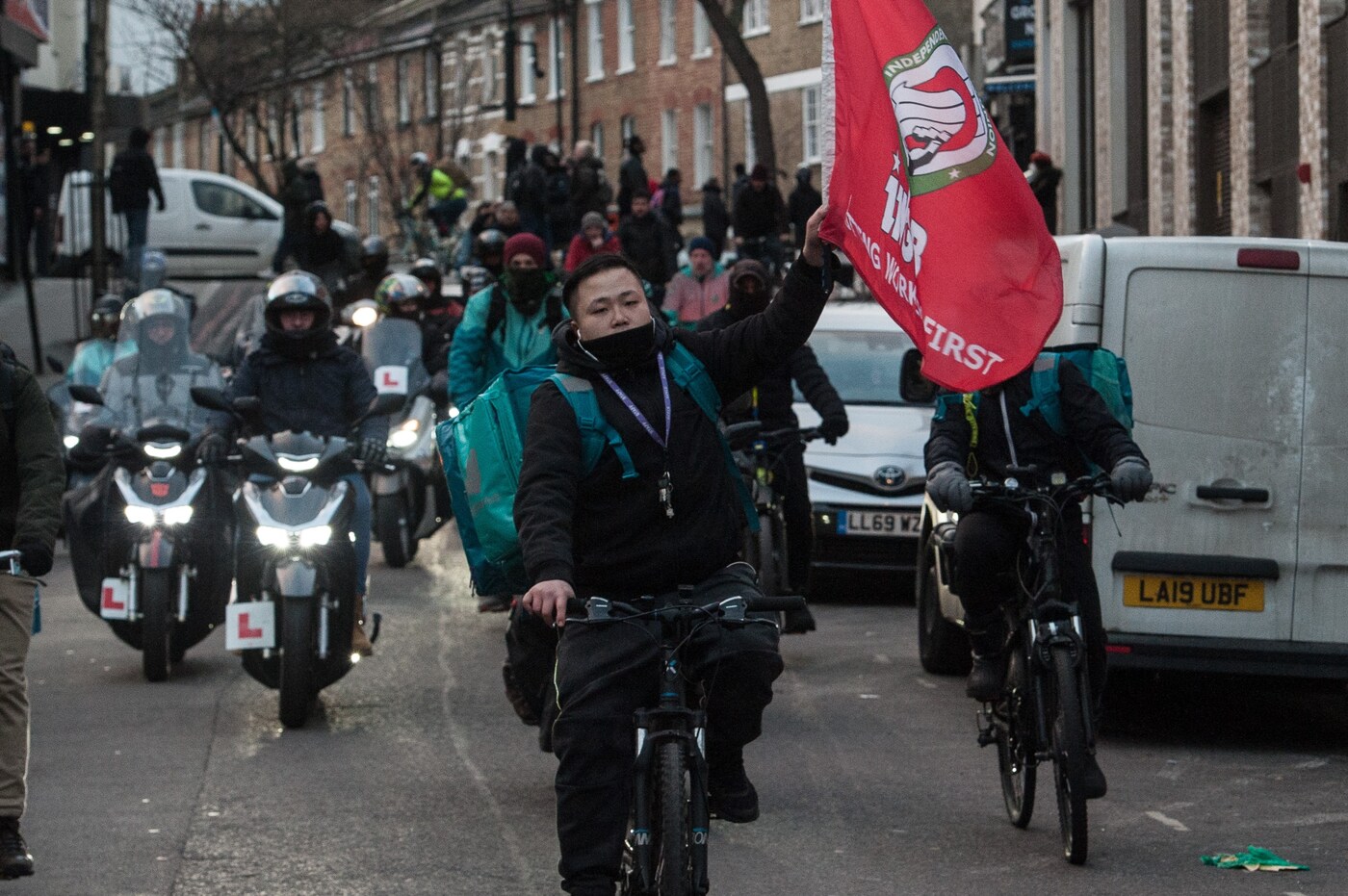 Deliveroo riders attend a protest at Hackney Town Hall 