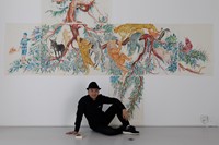Chinese Artist Wu Junyong in front of his video in 9