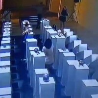 Woman destroys art taking selfie