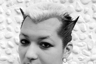 A punk with a Soo Catwoman tattoo on her shoulder,