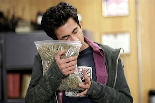man hugging weed