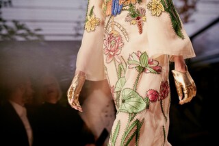 White silk organdy gown with embroidered motifs