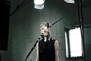 Long fringe dress by Jil Sander, earphones with fr