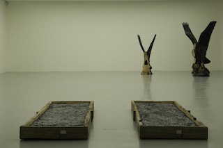 In the background: Three, 2008 mahogany/tar variab