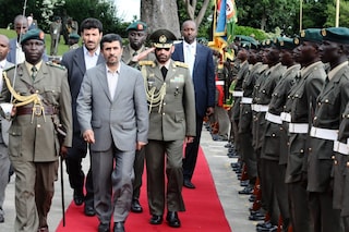 Iranian President Mahmoud Ahmadinejad inspects a g