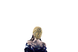 Dress by Rochas; crystal mask and boots by Maison 