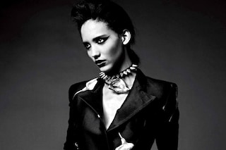 Suit, lily choker and belt by Yves Saint Laurent; 