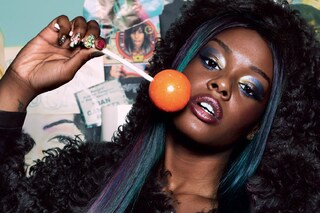 Shearling hooded jacket by Alexander Wang; earring