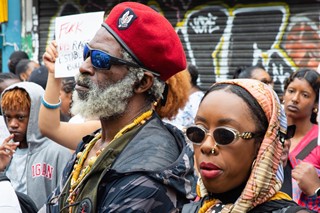 Protesters outside Peckham Hair and Cosmetics