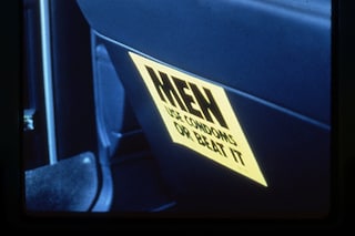 The Gran Fury sticker - Men, Use Condoms, Or Beat It