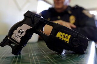 A policeman with a taser