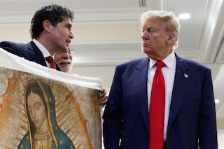 Donald Trump is presented with a piece of art, 2024
