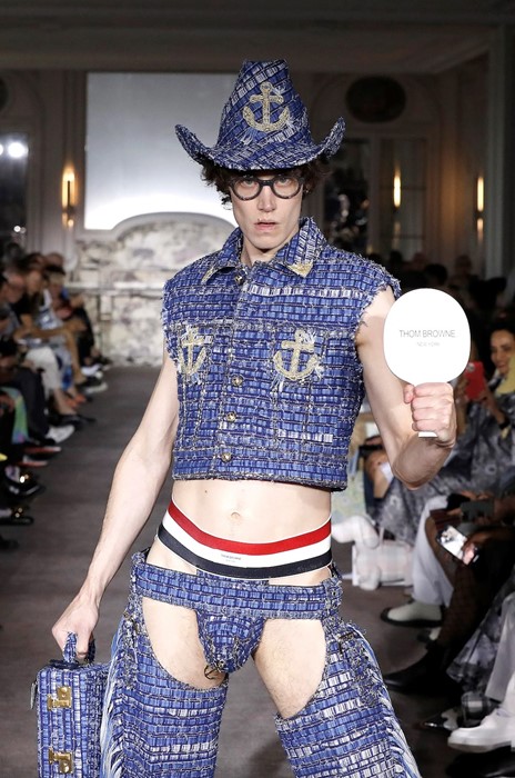 Bums out for the boys! The high fashion jockstrap rears onto the runway ...