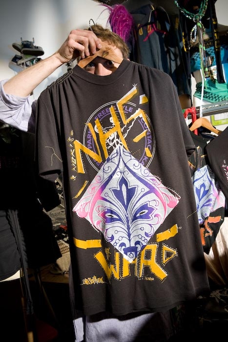 Taz, without the makeup, hiding behind one of his 9