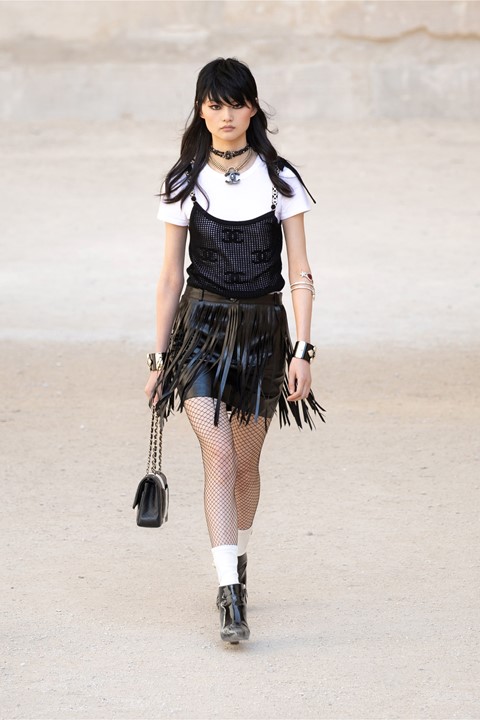 Punk rawk! Fishnets, dog collars, and heavy side fringes are in at Chanel