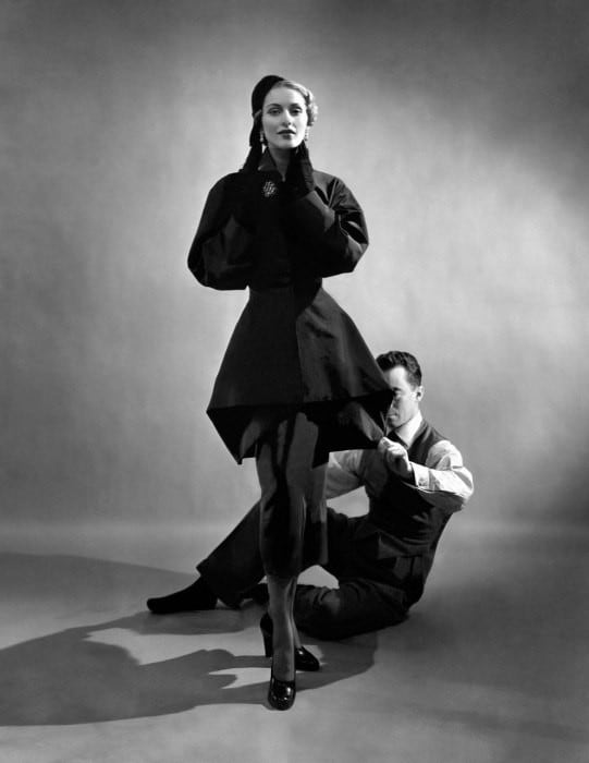 Charles James pinning a suit on model from the Mar 7