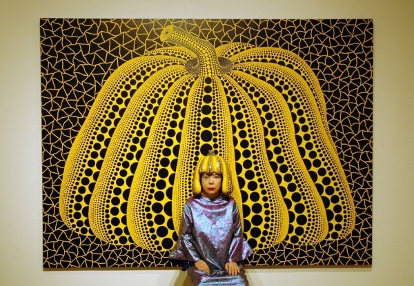 Yayoi Kusama in front of pumpkin 10