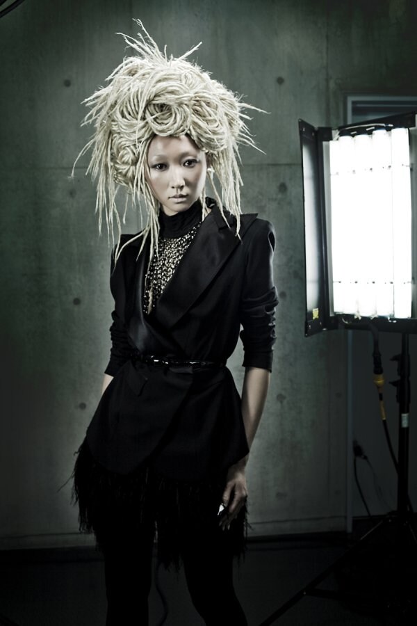Jacket and skirt by Louis Vuitton, chained neck pi 7