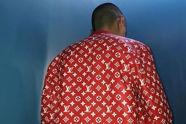 NYFW Pop Of Red: Supreme x Louis Vuitton Bag & Joseph Pants
