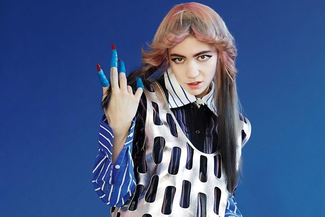 Grimes teases new song Player Of Games with messages in binary code