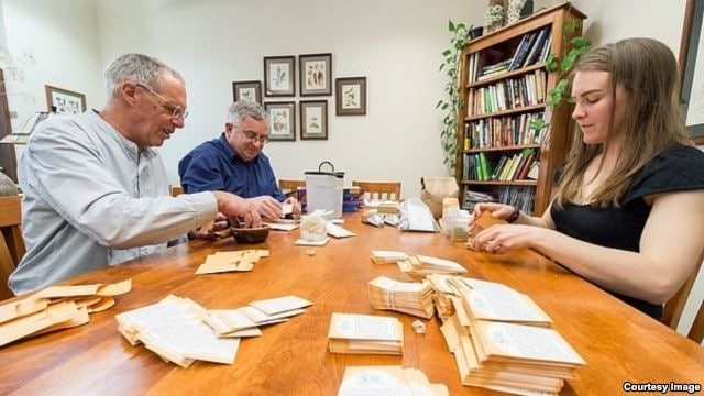 10) OSSI members filling seed packets (credit to t