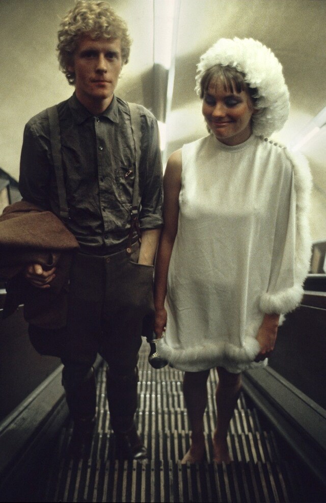 Couple on escalator 67 23