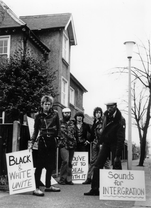 Caroline Coon, “BLACK and WHITE UNITE” (1977) 1