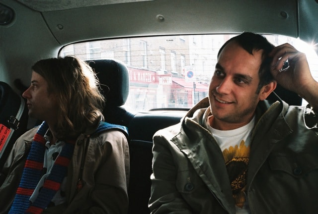 In a taxi cab leaving BBC Studios, on the way to N 10