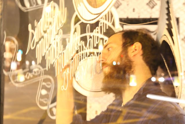 McBess installing his exhibition 2
