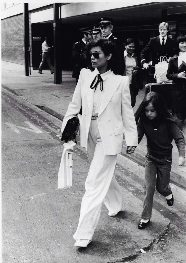 Bianca Jagger wears a YSL le smoking tuxedo