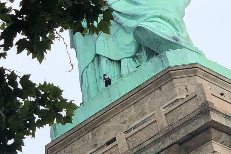 A woman has scaled the Statue of Liberty to protest ICE | Dazed