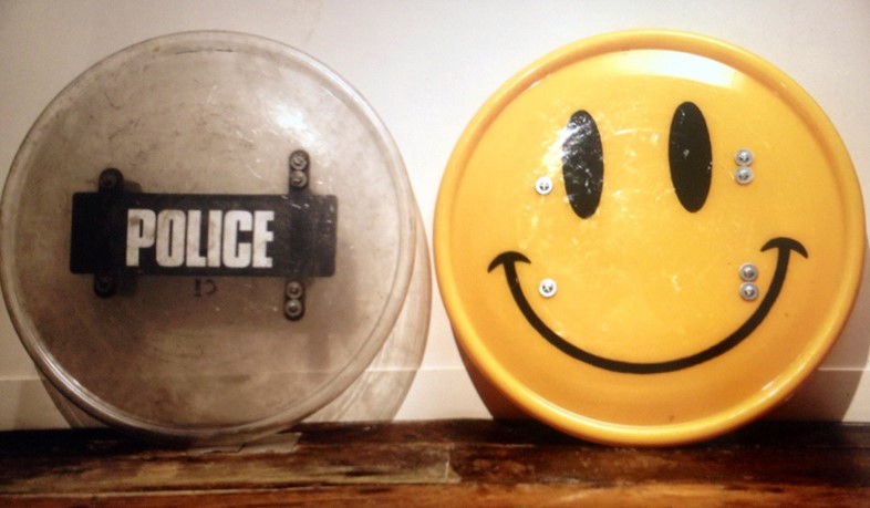Smiley riot shield before and after