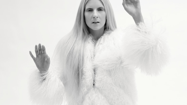 Jonna Lee wears coat by Ralph Lauren Collection
