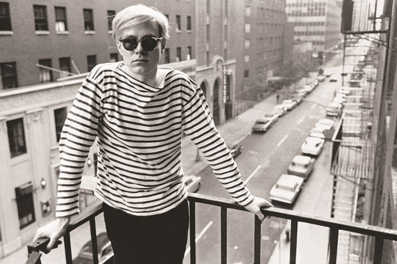 Warhol on fire escape of the Factory, 231 East 47th Street