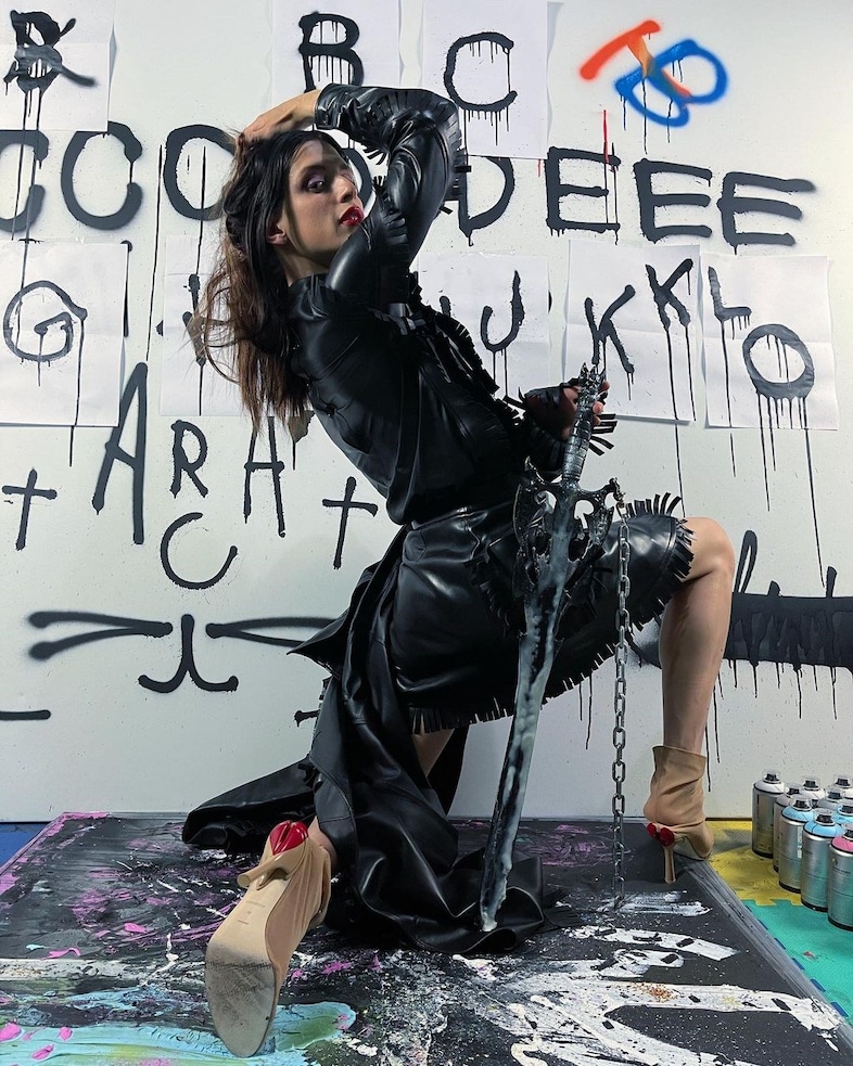 Arca wearing Burberry 2