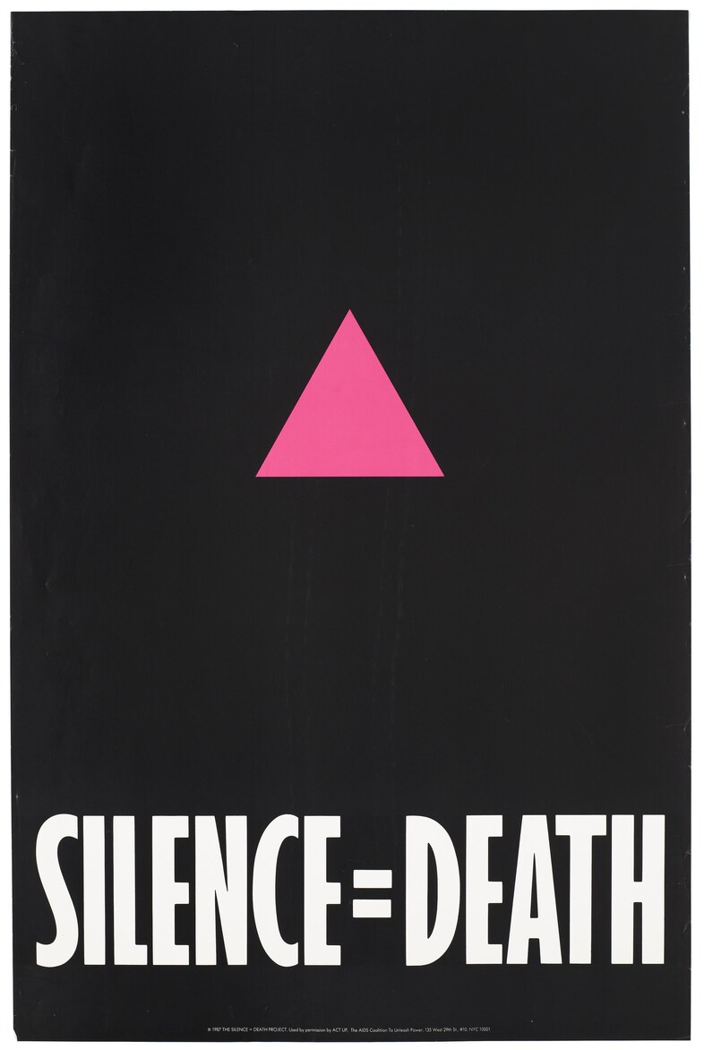 A_pink_triangle_against_a_black_backdrop_with_the_