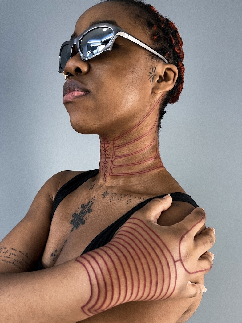 Emmanuel Uchenna Item tattoos
