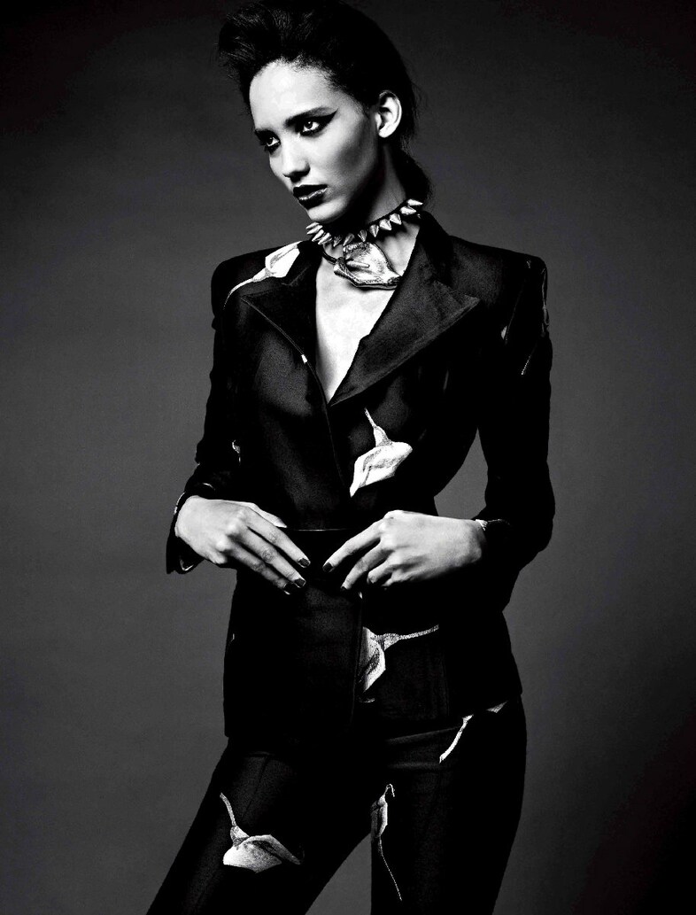 Suit, lily choker and belt by Yves Saint Laurent; 2