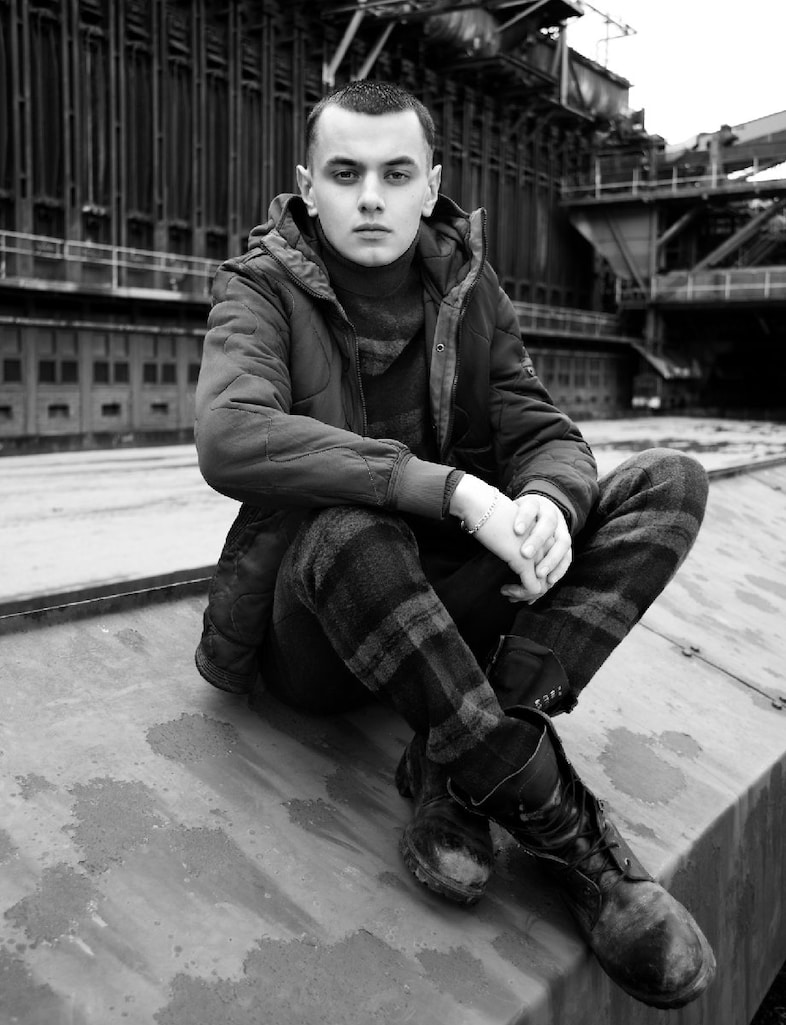  RUDI wears jacket by STONE ISLAND; jumper and tro 2