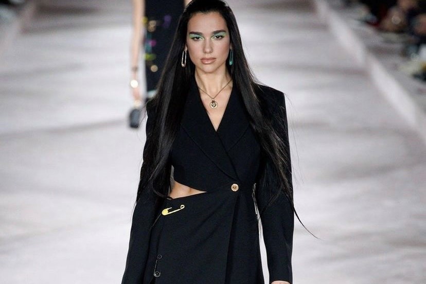Dua Lipa brings showbiz glamour to Versace show on her catwalk