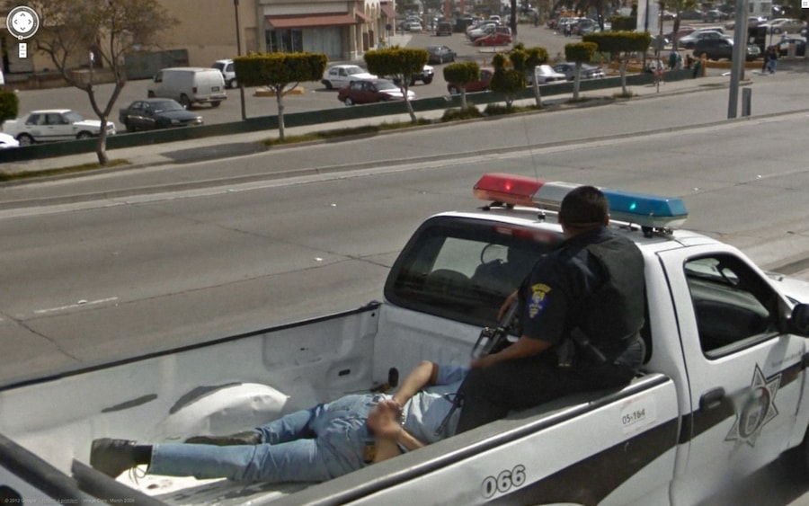 police-officer-gun-prisoner-truck 14