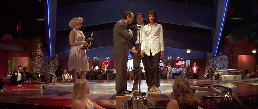 Uma Thurman, gold Chanel pumps, Pulp Fiction still 9