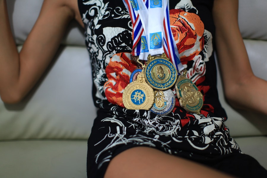 Lolita posing with her running medals 4